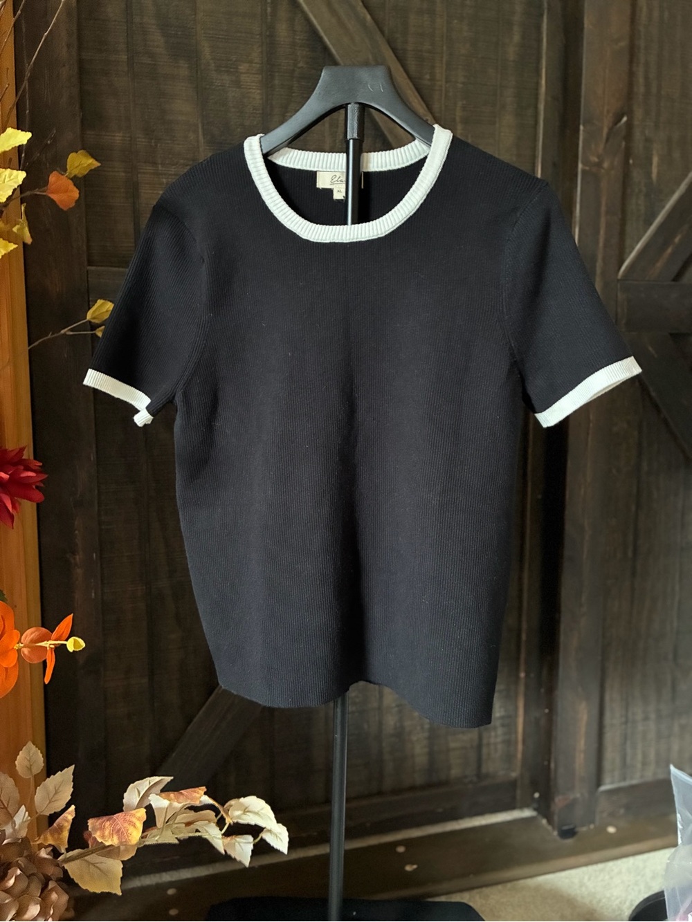 Elan Black Short Sleeve Knit Top with White Trim pit 2 Pit 21. L 26
